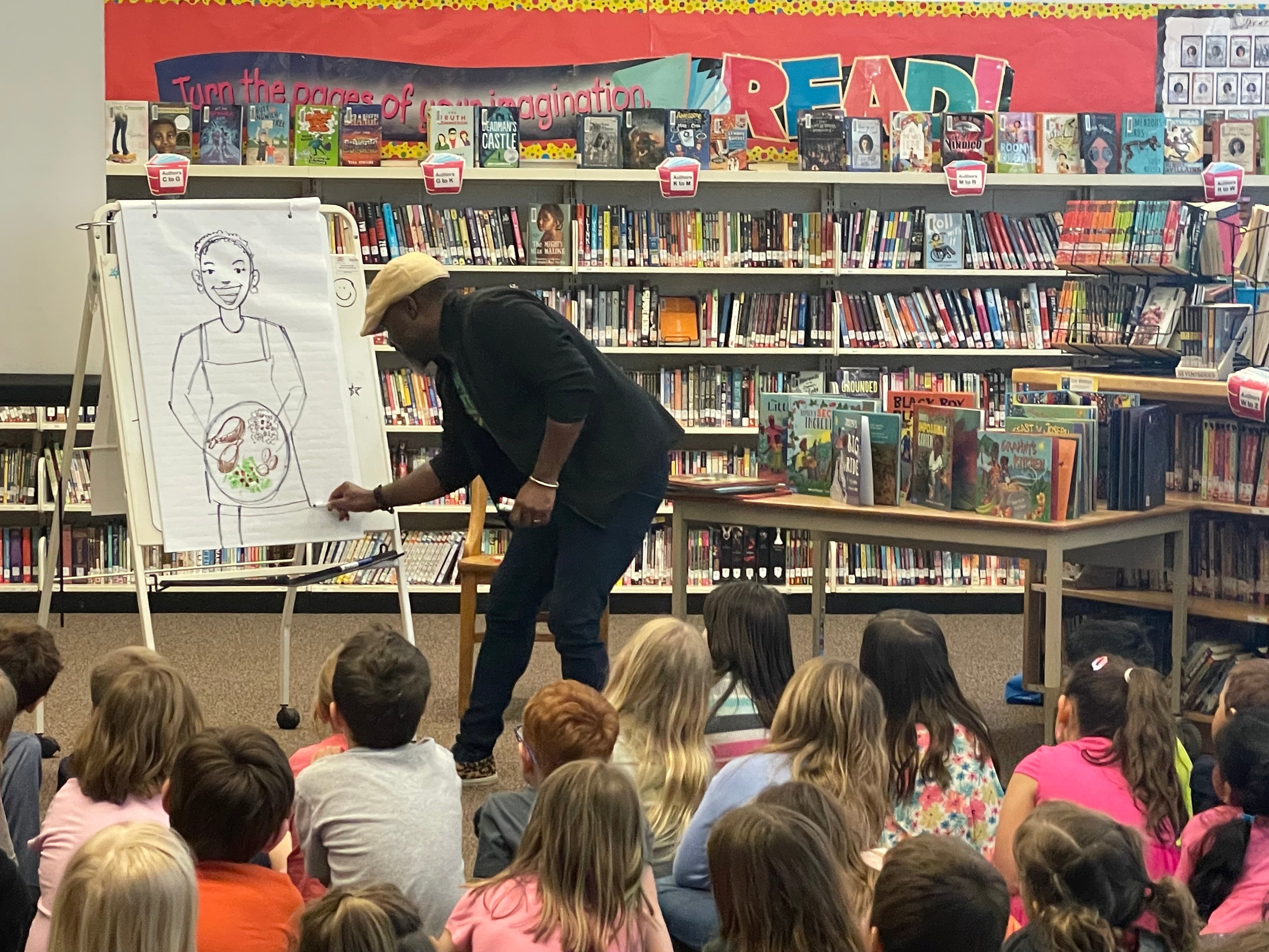 Illustrator Ken Daley giving an illustration demo during Book Week school visit.
